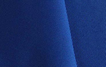 close up of blue polyester twill fabric for embroidered patches