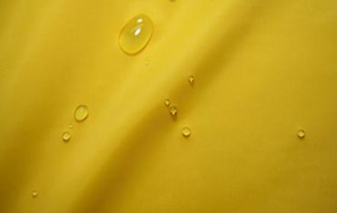 Yellow color water resistant nylon fabric which is used as base fabric for embroidered patches